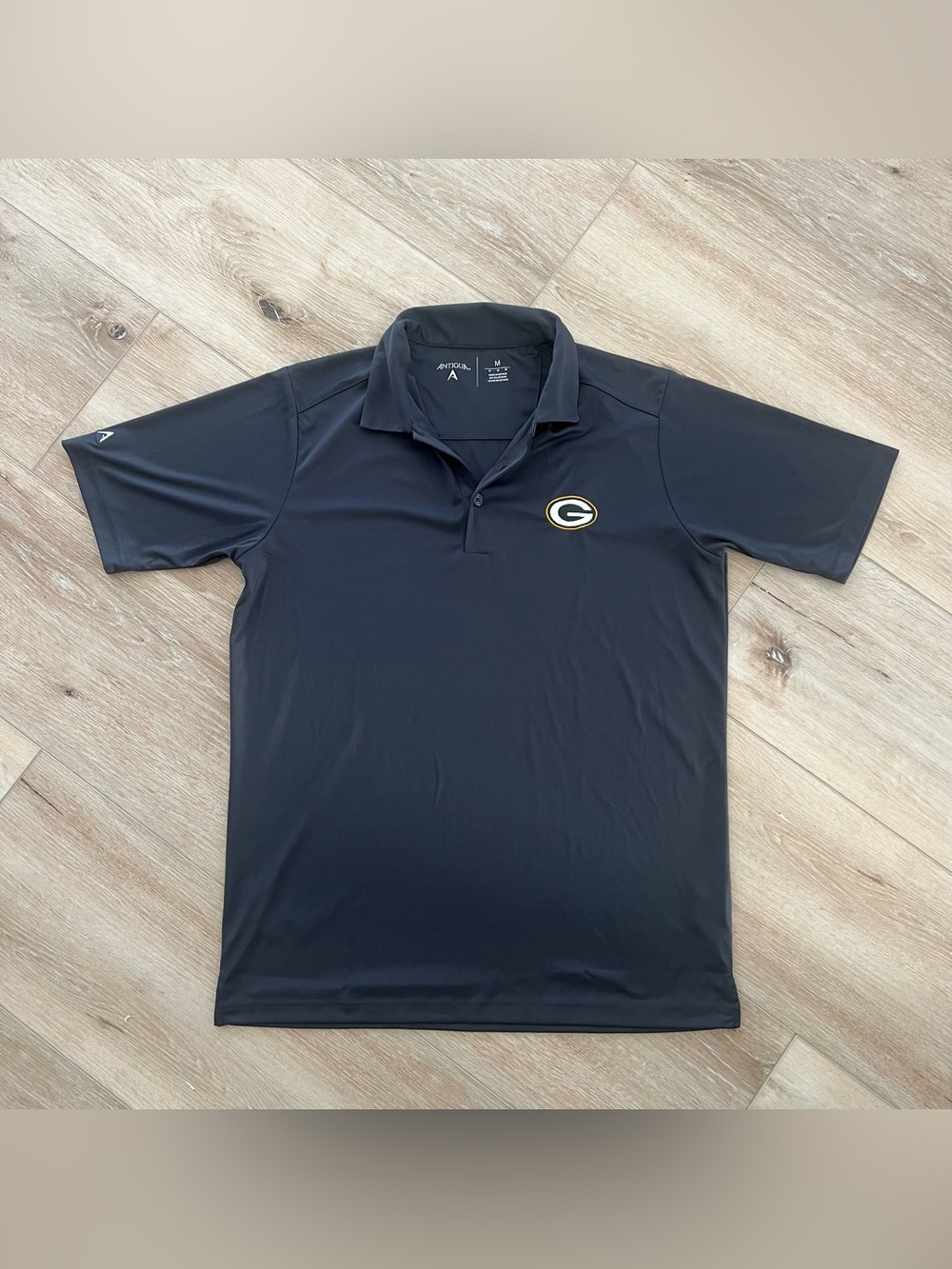 Antigua Black Green Bay Packers Logo Polo